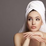 Closeup portrait of young beautiful woman after bath